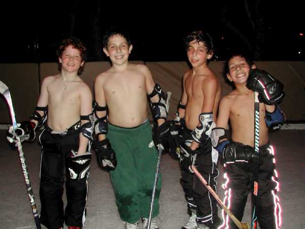 Naked backyard ice hockey
