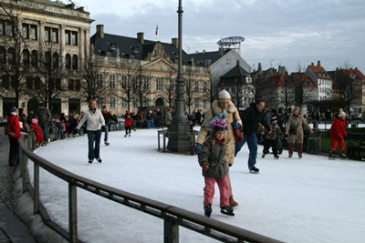 Ice Skaters Enjoying Outdoor Skating Rink Kongens Nytorv, in Copenhagen, Denmark