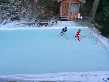 Backyard ice rink of Claudio Iatan showing the plastic ice rink liner method.