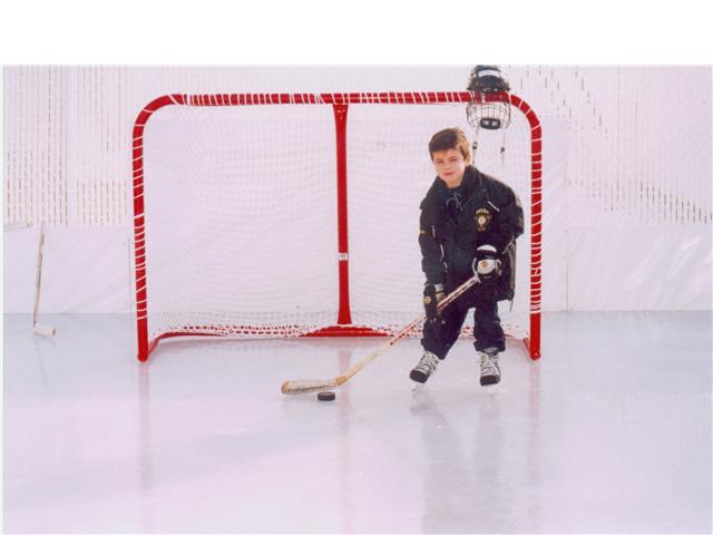 My young son on my first backyard ice rink.