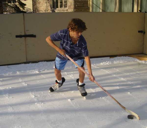 Playing with shorts on a refrigerated backyard hockey ice rink.
